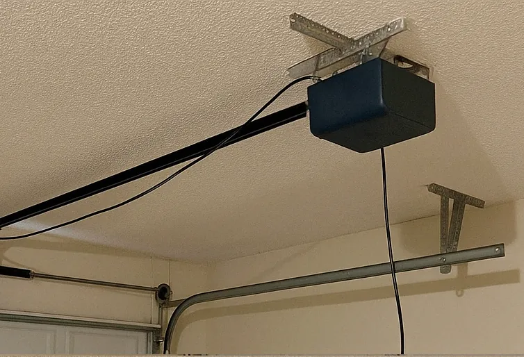 Garage door opener unit inspected before repair
