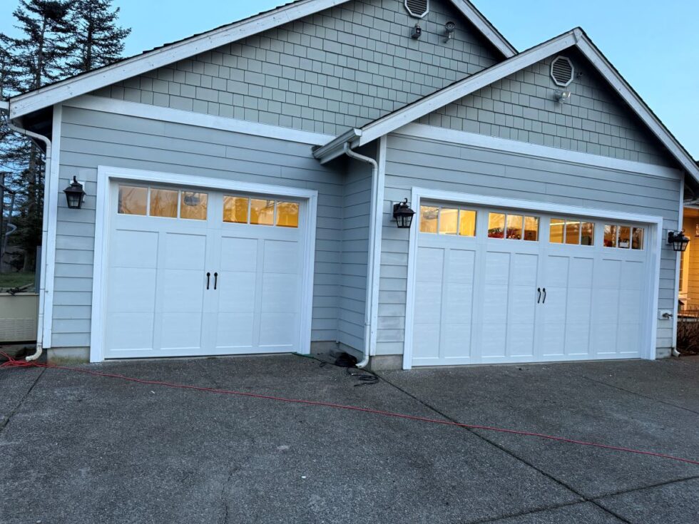 Newly installed carriage house style garage door on a Bedford home