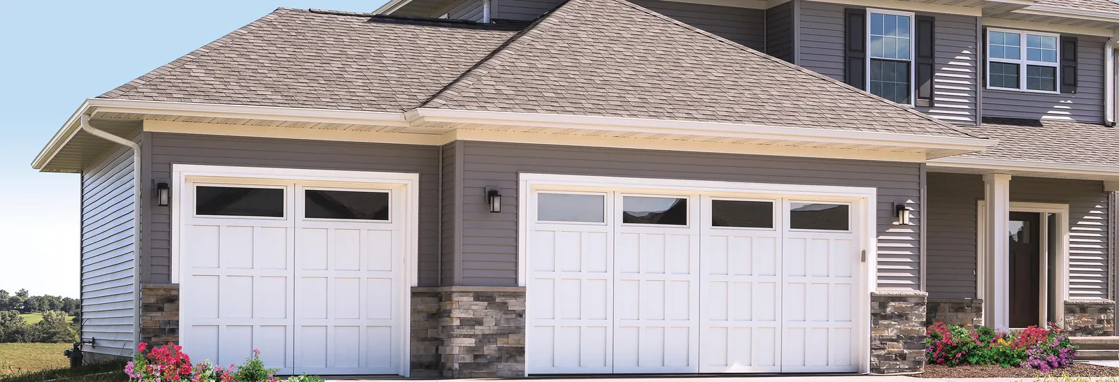 New garage door installed on a suburban home exterior