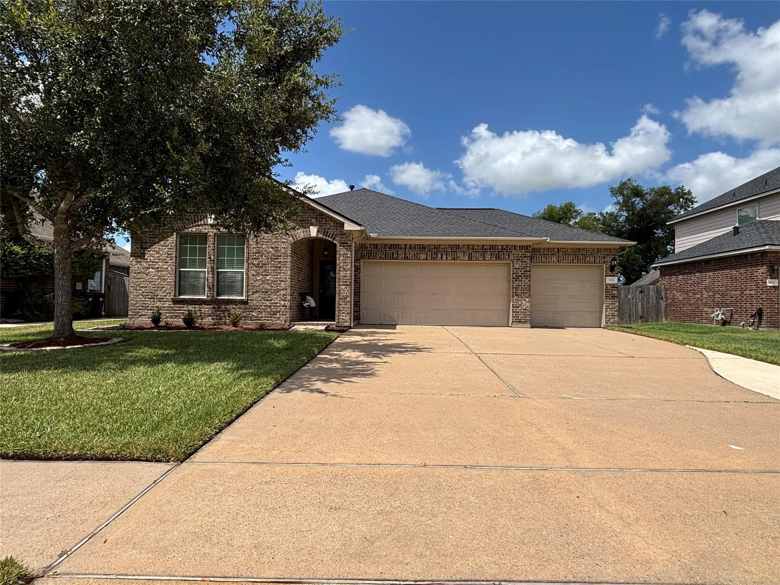 Home exterior with garage door in Brookwood Hills Bedford Texas