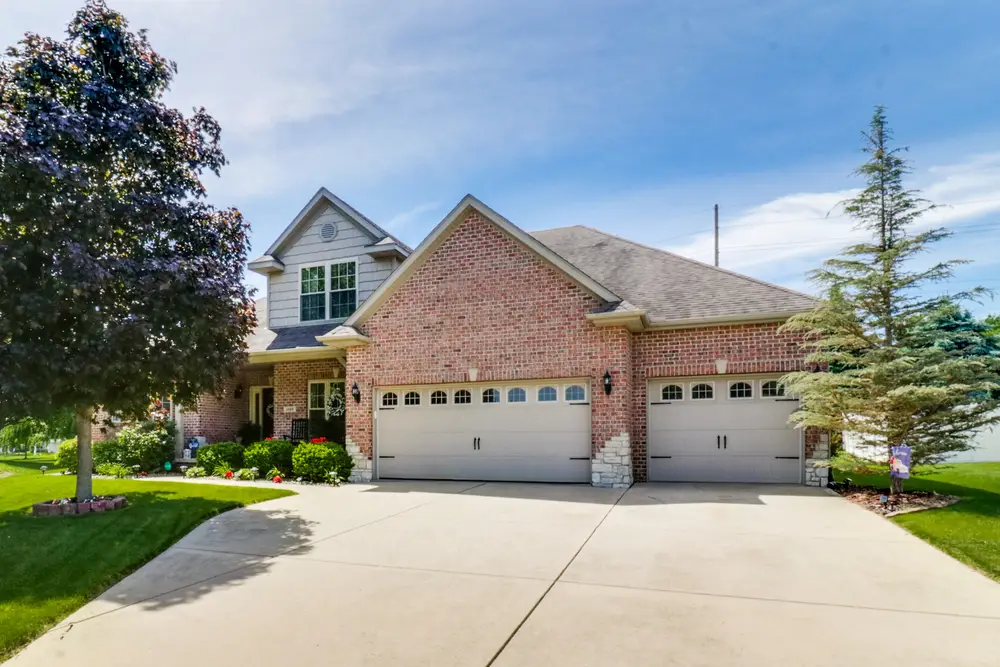 Suburban house with attached garage in Oak Grove Estates Bedford