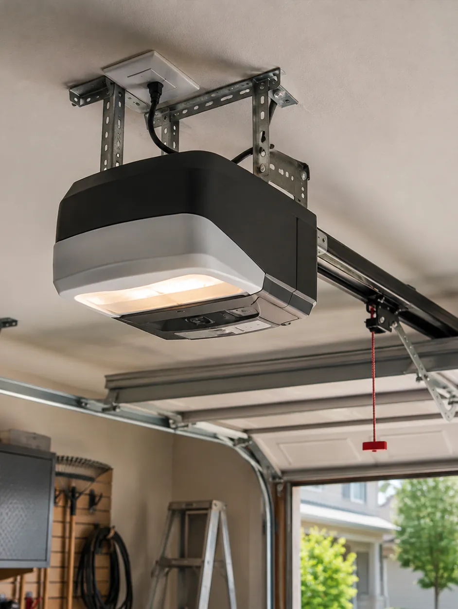 Garage door opener motor unit mounted on the garage ceiling