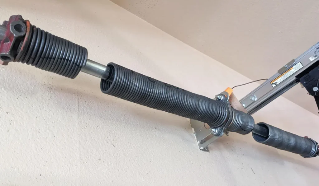 Broken garage door spring ready for professional replacement